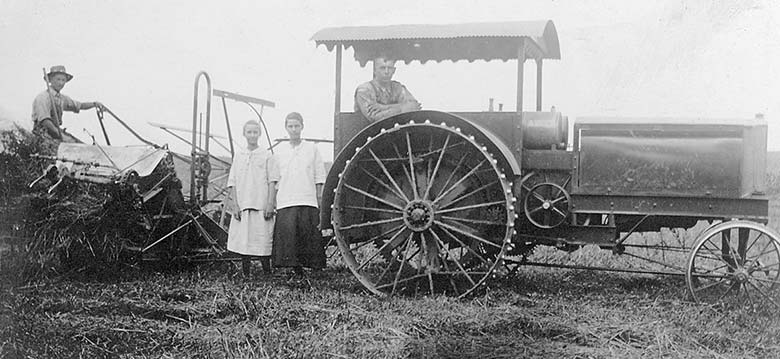 Four kids and steel wheel tractor